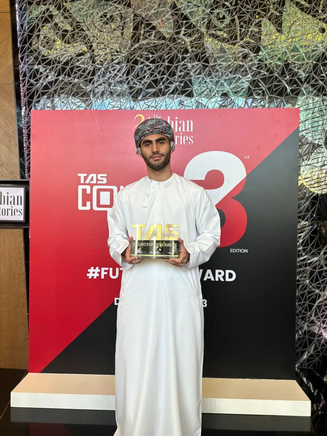 Shihab Mebarez holding Bullseye DDB's award for Excellence in Experiential Marketing at The Arabian Stories Awards 2023